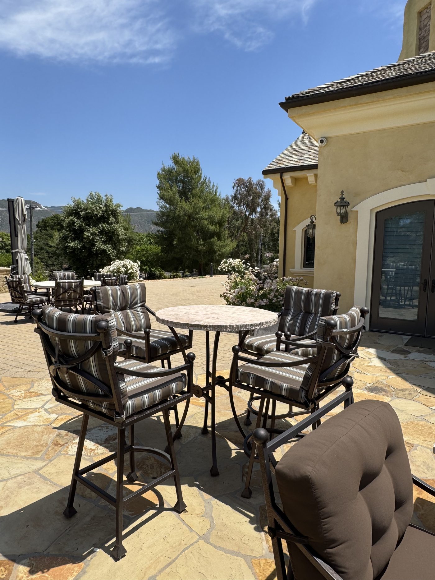 Outdoor high-top bar set with striped cushions